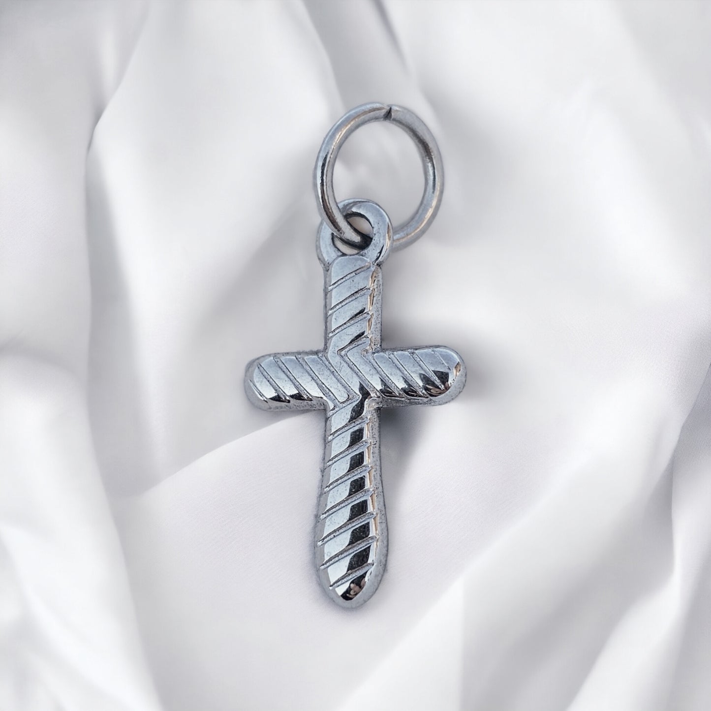 Striped cross charm